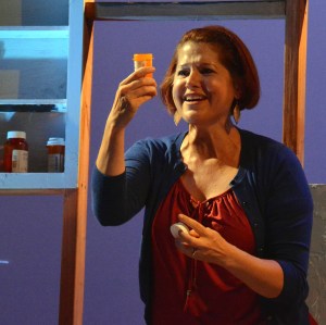 Lisa-Marie Newton as Diana struggles with her feelings about taking pills for her bipolar disorder in "Next To Normal". Photo Credit: Jay Yamada.