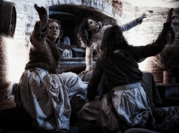 The Weyard Sisters (Julie Douglas, Maria Leigh, Caroline Parsons) concoct their witches' brew.