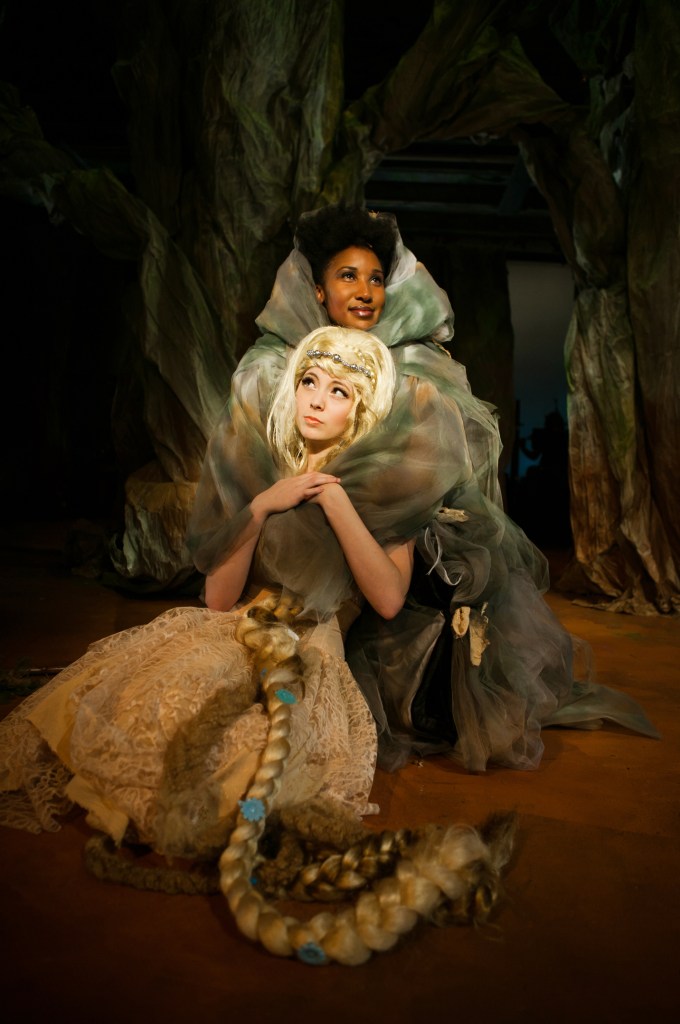 Rapunzel (Noelani Neal) is comforted by her “mother” the Witch (Safiya Fredericks). Photo Credit: Jessica Palopoli.