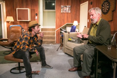 Damian (Harold Pierce) and Howard (Julian López-Morillas) hilariously bond over vodka. Photo Credit: Cheshire Isaacs.