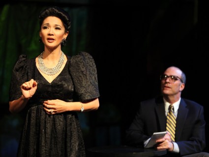 Imelda (Beverly Sotelo) grants an interview to Bob Stone (Lawrence Radecker). (photo Jennifer Reiley) in Magic Theater's production of "Dogeaters" by Hagedorn.