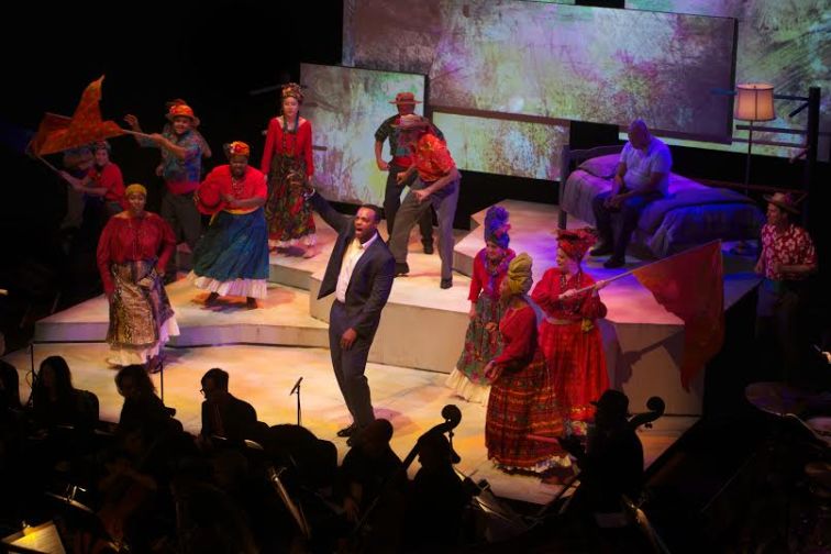 Kenneth Kellogg as Young Emile Griffith (center) and Arthur Woodley as Old Emile Griffith (right rear, on bed) and chorus in Opera Parallèle's production of "Champion: An Opera in Jazz" at SFJAZZ. Photo Credit: Opera Parallèle.