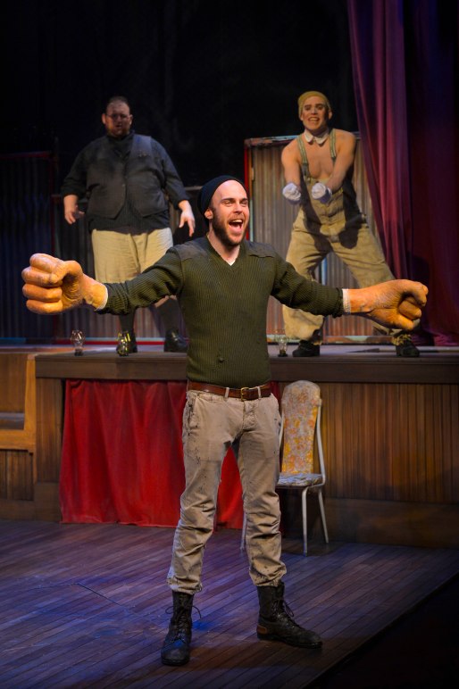 Big Joe (Ian Merrigan) finds his strength—and really big fists—in The Unfortunates, playing at A.C.T.’s Strand Theater through Sunday, April 10. (Background, L-R: Arthur Wise and Eddie Lopez). Photo by Kevin Berne.