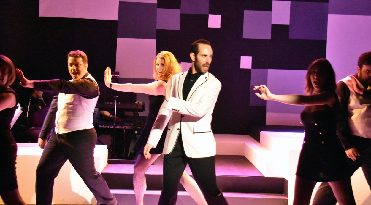 Why are is a chess champion and a dancing chorus line singing about a mad night in Bangkok? Who knows? Don't worry; have fun. Photo Credit: Jay Yamada.